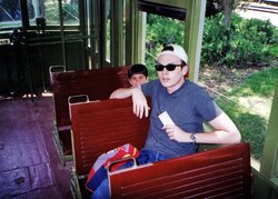 Cody and Braden riding a train at the train museum