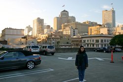 Tina standing in front of a bunch of cool looking buildings