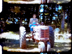 Greg and Jesse on tractor, Xmas, Tombstone Ghost Town (8 mm, 3 inch reel)