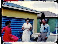Mom and Dad, bikes, Greg and Tamara acting silly on front lawn, Knott’s Berry Farm (8 mm, 3 inch reel)