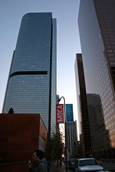 Cody in the shadow of buildings