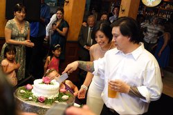 Cody & Christina slicing the cake